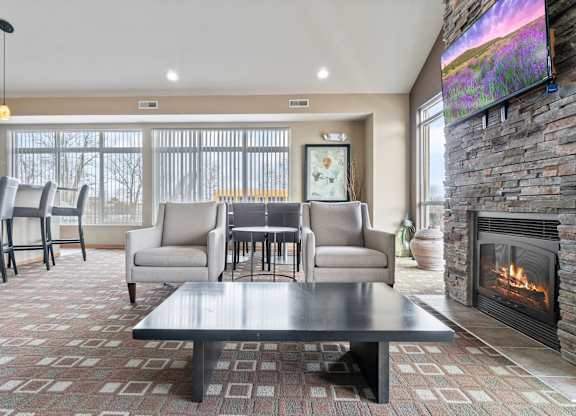 the preserve at ballantyne commons living room with fireplace and table